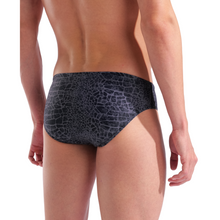 Load image into Gallery viewer, Person wearing a patterned black swim brief on a white background