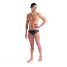 Load image into Gallery viewer, Man wearing a patterned swim brief on a white background