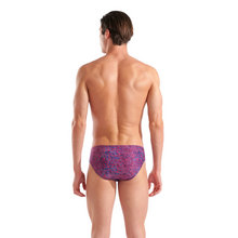 Load image into Gallery viewer, Man wearing a red and blue patterned swim brief on a white background