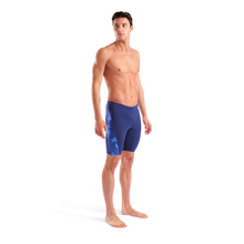 Load image into Gallery viewer, Man wearing blue swim shorts on a white background