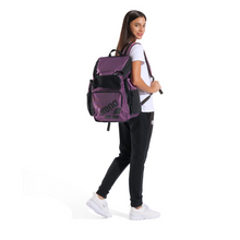 Load image into Gallery viewer, Woman wearing a purple backpack on a white background