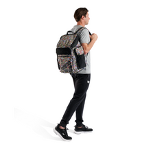 Load image into Gallery viewer, Person wearing a skull-patterned backpack on a white background