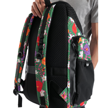 Load image into Gallery viewer, Backpack with floral straps held by a person on a white background