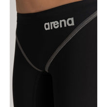Load image into Gallery viewer, arena Race Suit for Boys in Black - Boys' Powerskin ST 2.0 Jammer model front arena logo close-up