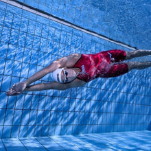 Load image into Gallery viewer, arena Race Suit for Women in Red - Women’s Powerskin Carbon Air2 Open-Back Kneeskin model swimming in pool