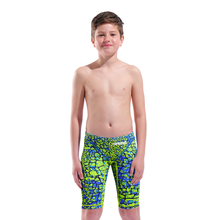 Load image into Gallery viewer, Boy in an arena green and blue snakeskin Powerskin ST NEXT racing suit
