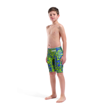 Load image into Gallery viewer, Full-length of a boy in an arena green and blue snakeskin Powerskin ST NEXT racing suit

