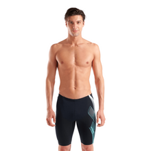 Load image into Gallery viewer, Man wearing black swim jammers with a geometric pattern on a white background
