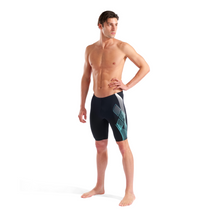 Load image into Gallery viewer, Man wearing black and teal swim jammers on a white background
