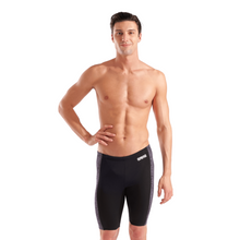 Load image into Gallery viewer, Man wearing black swim jammers with Arena logo on a white background
