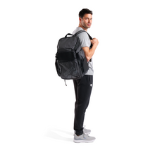 Load image into Gallery viewer, Man wearing a black backpack on a white background
