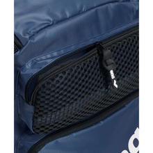 Load image into Gallery viewer, Close-up of a blue backpack with a black mesh pocket and visible brand logo.
