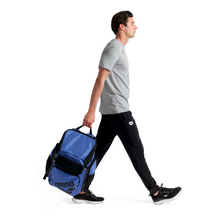 Load image into Gallery viewer, Man walking with a blue and black bag on a white background

