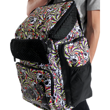 Load image into Gallery viewer, Backpack with colorful skull pattern held by a person
