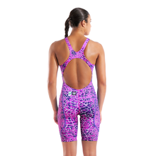 Load image into Gallery viewer, Back of a woman in an arena pink and purple snakeskin Powerskin ST NEXT racing suit
